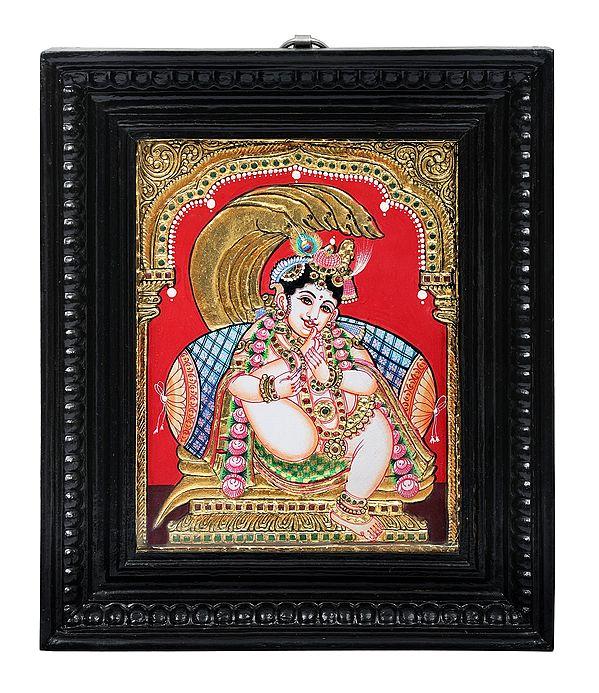 exotic india Krishna Sucking His Thumb Tanjore Painting | Traditional Colors With 24K Gold | Teakwood Frame | Gold & Wood | Handmade | Made In India 