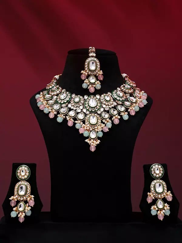 exotic india Kundan Studded and Beaded Necklace Set with Earrings and Mangtika 