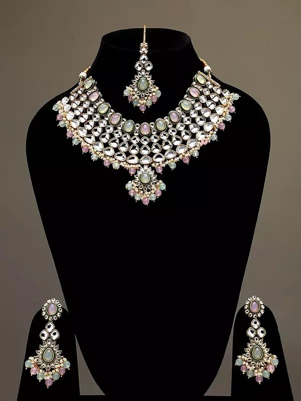 exotic india Kundan Studded and Beaded Necklace Set with Earrings and Mangtika 