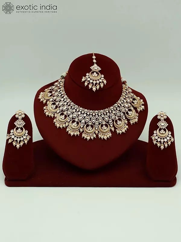 exotic india Kundan Studded Brass Necklace Set For Women With Earrings And Mangtika 