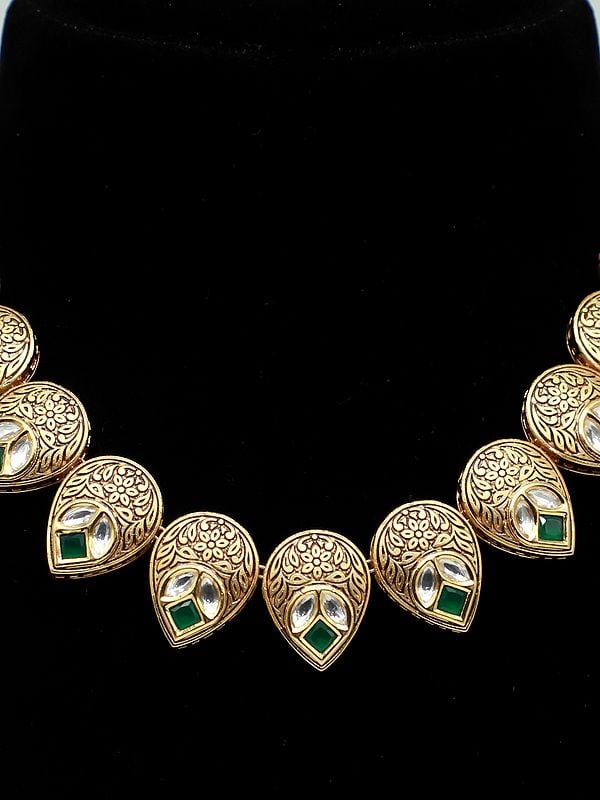 Exotic India Kundan Studded Light Necklace Set With Brass Carving Tops For Women