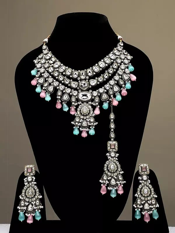 exotic india Kundan Studded Three Layered Necklace Set with Earrings and Mangtika with Beads Drop 