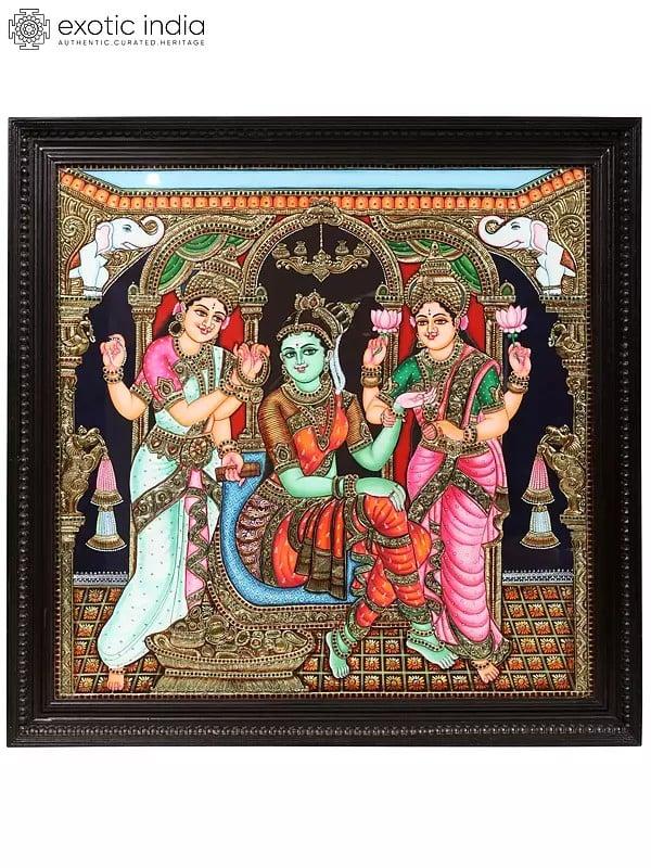 exotic india Lakshmi and Saraswati Doing Wedding Shringar of Devi Parvati | Framed Tanjore Painting