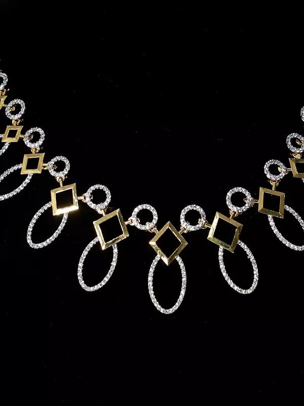 Exotic India Leaf Design Elegant Stone Studded American Diamond Necklace Set With Earrings