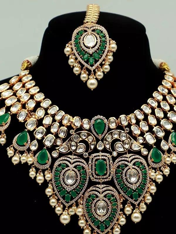 Exotic India Leaves Design Brass Heavy Necklace Set With Mangtika And Earrings