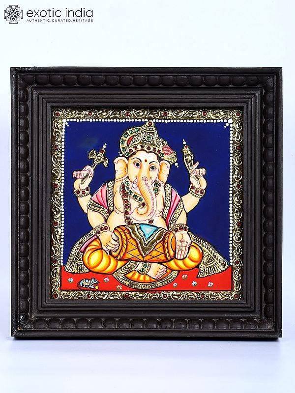 exotic india Lord Ganesha Playing Dholak | 24 Karat Gold Work | Framed Tanjore Painting 