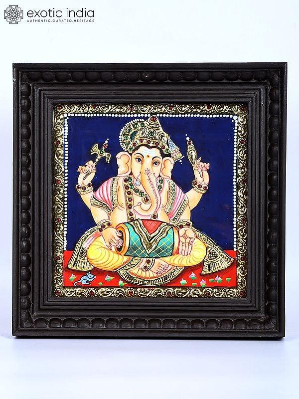 exotic india Lord Ganesha Playing Dholak | 24 Karat Gold Work | Framed Tanjore Painting 