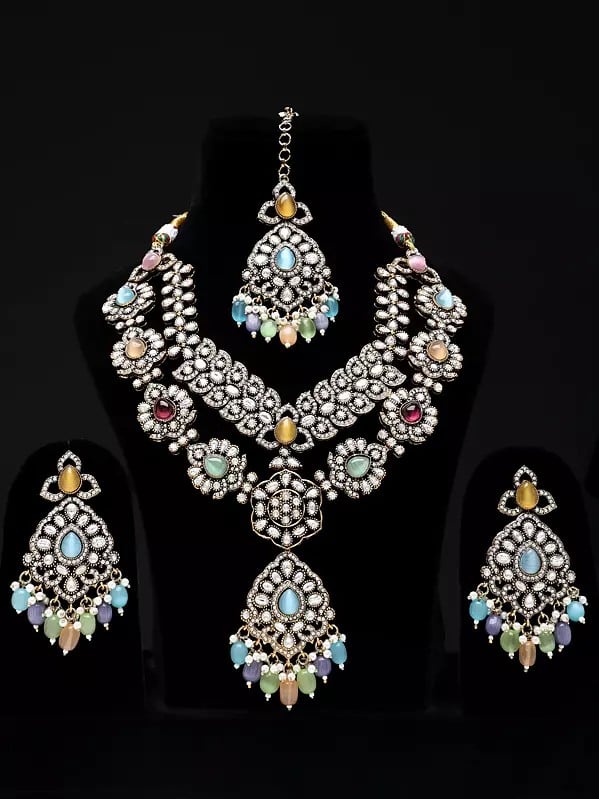 Exotic India Multicolor AD Stone With Drop Beads Necklace With Earrings And Mangtika Set