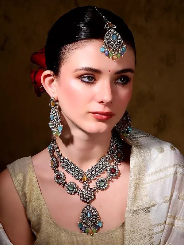 exotic india Multicolor AD Stone with Drop Beads Necklace with Earrings and Mangtika Set 