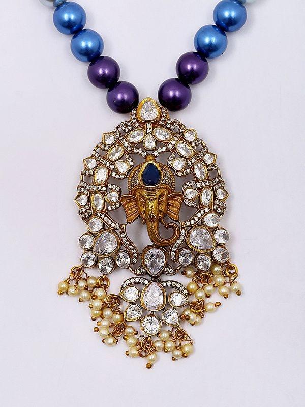 Exotic India Multicolor Pearl Strand Lord Ganesha Face Necklace Set With Earrings