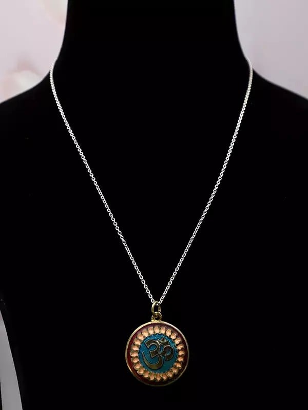 Exotic India Om Design Round Shape Pendant In Brass