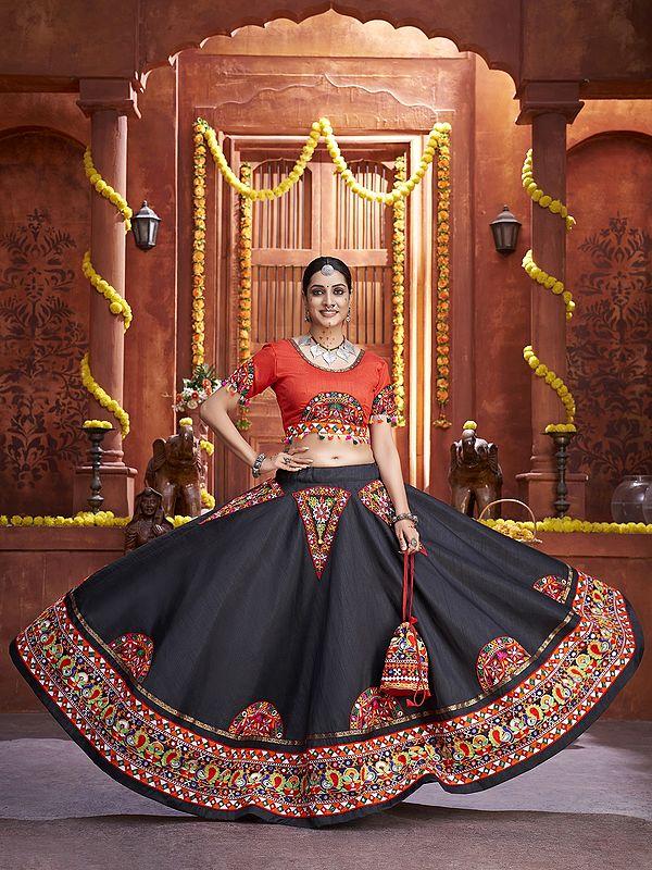 Exotic India Orange-Black Beautiful Traditional Lehenga Choli And Dupatta With Attractive Border Lace And Mirror Hand Work 