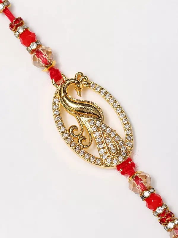 Exotic India Oval Shape Stone Studded Peacock Rakhi 