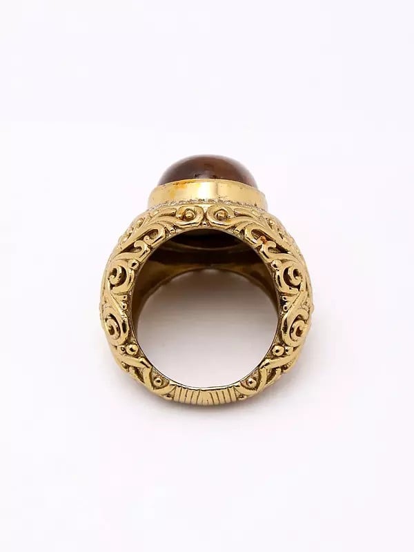 Exotic India Oval Shape Tiger Eye Ring With Scrollwork Patterns 