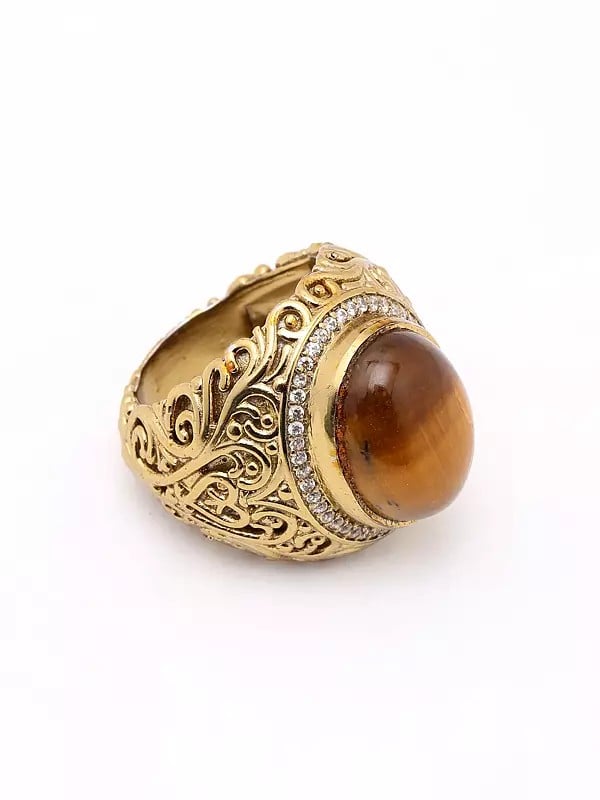 Exotic India Oval Shape Tiger Eye Ring With Scrollwork Patterns 