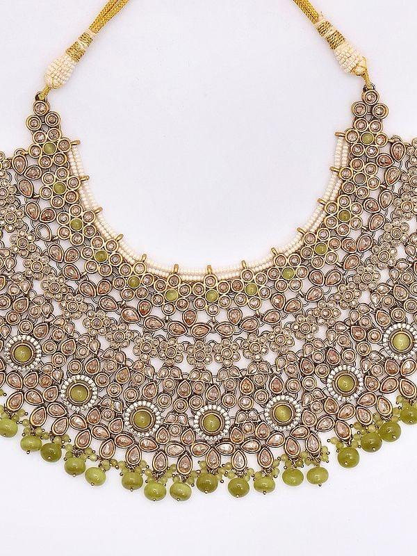 Exotic India Padmavati Stone Studded And Beaded Choker Necklace Set With Earrings And Mangtika 