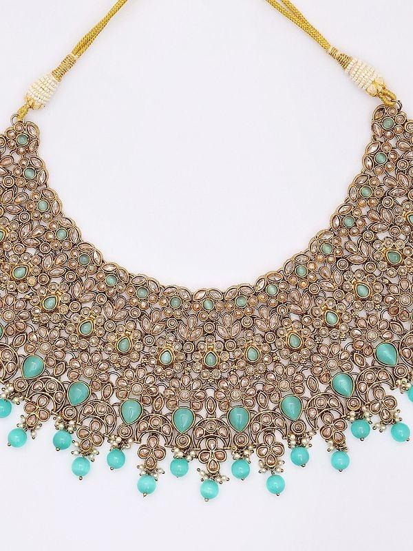 Exotic India Padmavati Stone Studded Choker Necklace Set With Earrings And Mangtika 