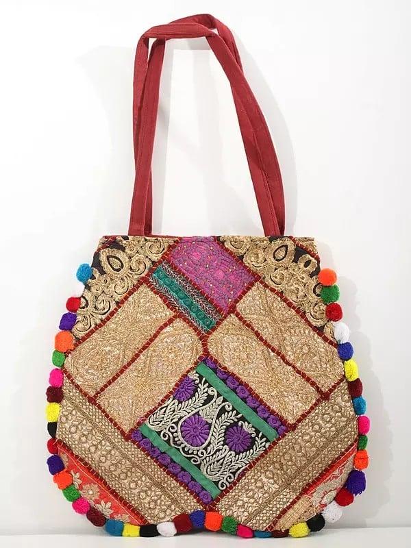 exotic india Patchwork Zari Embroidered Shoulder Bag with Pom Poms 