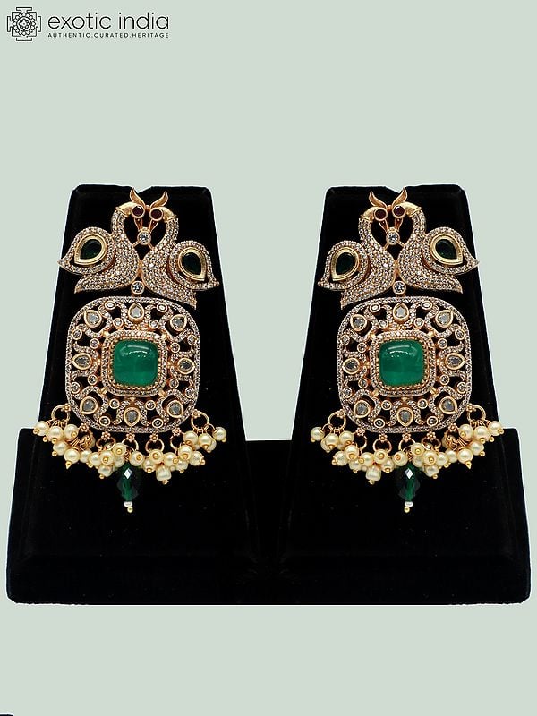 Exotic India Peacock Motif Moissanite Kundan With Matt Polish Necklace Set With Ruby Stones And Pearl Drops 