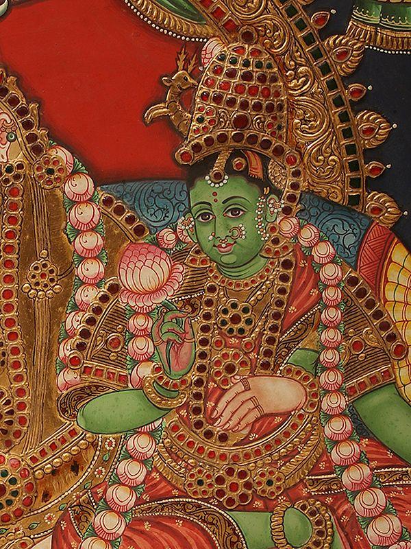 Exotic India Pradosha Moorthy (Shiva - Parvati) | Embossed Tanjore Painting | Traditional Colors With 24 Karat Gold | With Frame