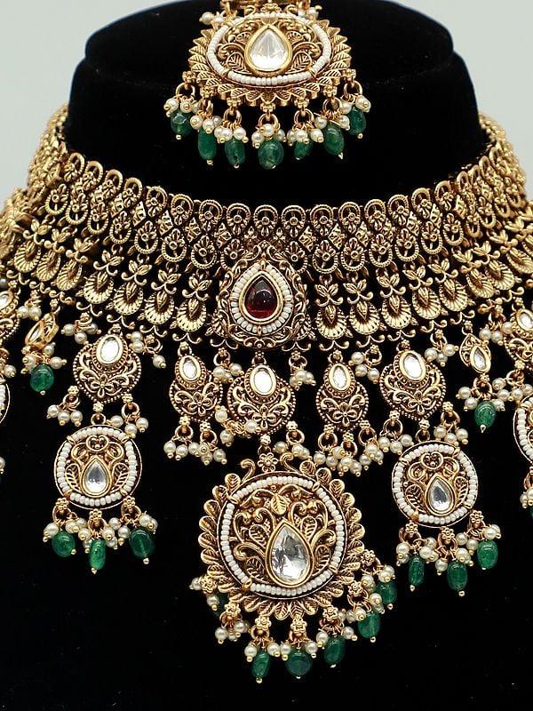 Exotic India Premium Matte Designer Carving Necklace Set With Beautiful Earrings And Mangtika
