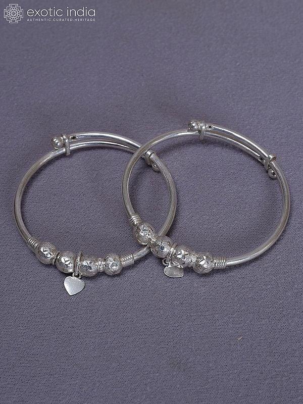 Exotic India Pure Silver Set Of 2 Engraved Baby Bala From Nepal 