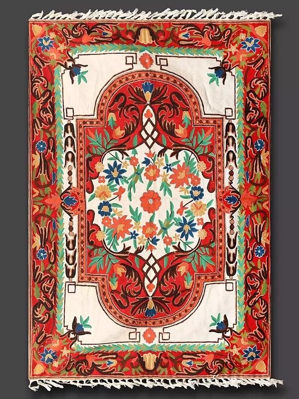 Exotic India Pure White & Red Chainstitch Embroidered Carpet With Tassels And Traditional Motifs From Kashmir