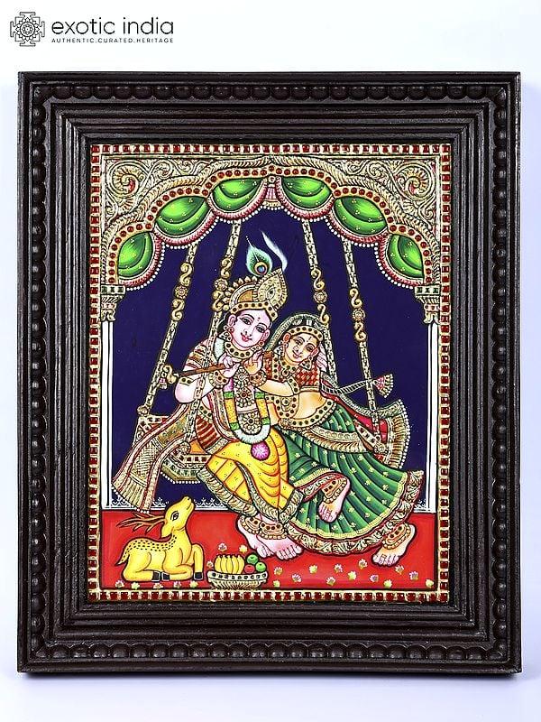 exotic india Radha Krishna on Swing | 24 Karat Gold Work | Framed Tanjore Painting 
