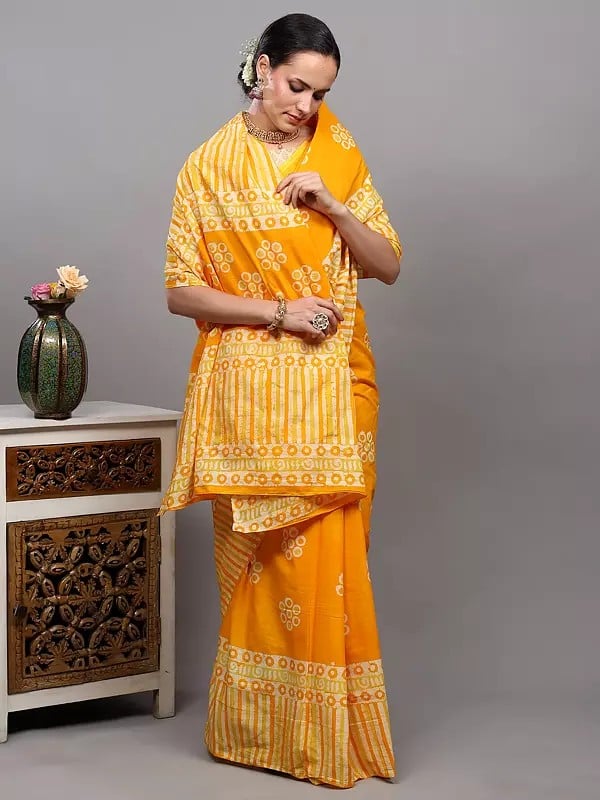 Exotic India Radiant-Yellow Batik Dyed Pure Cotton Saree With Printed Circle Motifs And Stripe Border From Gujarat 