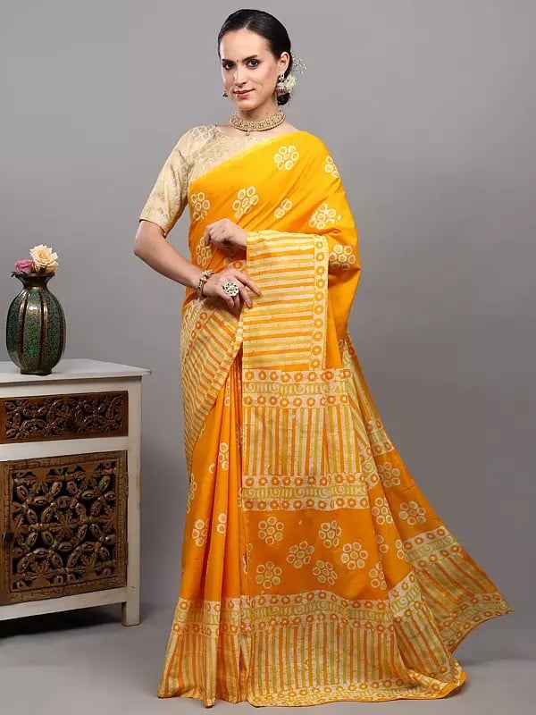 exotic india Radiant-Yellow Batik Dyed Pure Cotton Saree with Printed Circle Motifs and Stripe Border from Gujarat 