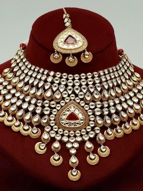 Exotic India Red Kundan Stone Heavy Necklace Set With Mangtika And Earrings 