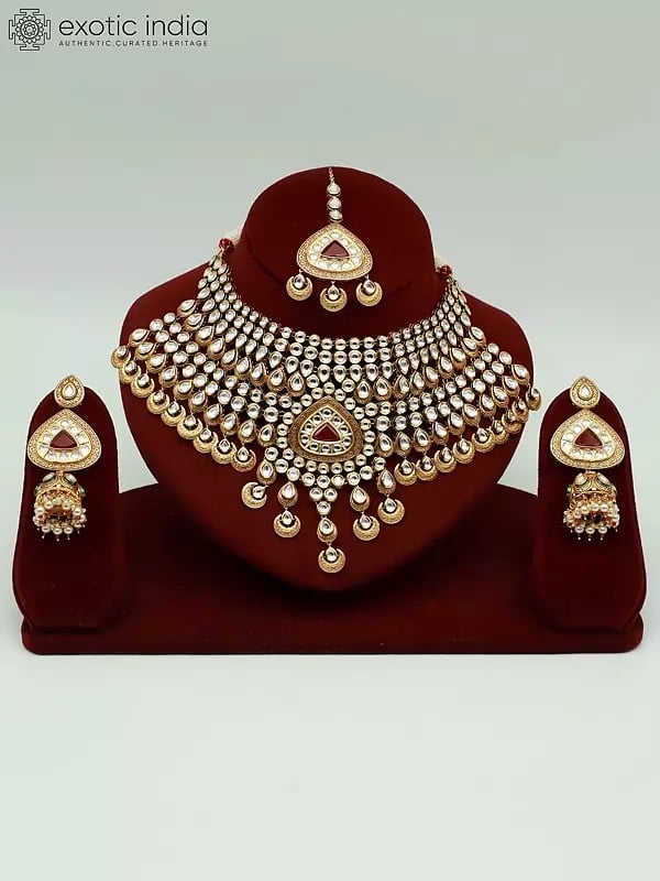 exotic india Red Kundan Stone Heavy Necklace Set With Mangtika And Earrings