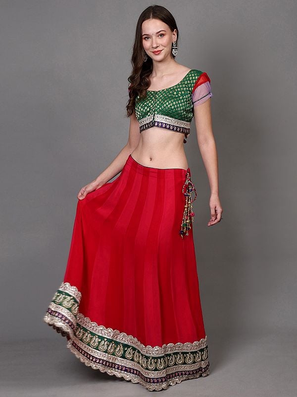 Exotic India Rethink-Pink Georgette Lehenga With Zari Brocaded Green Choli And Bead-Stone Embroidered Patch Border 