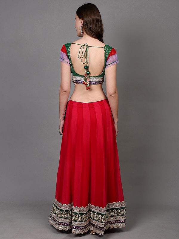 Exotic India Rethink-Pink Georgette Lehenga With Zari Brocaded Green Choli And Bead-Stone Embroidered Patch Border 