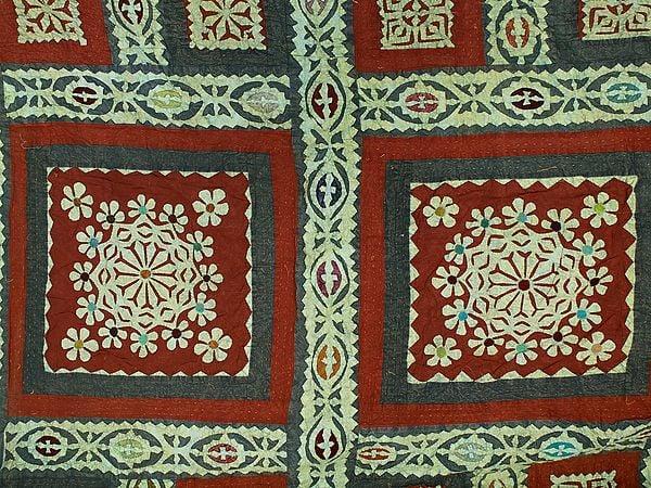 Exotic India Rust Kantha Bedcover With Multicolor Floral Applique Patches From Jodhpur