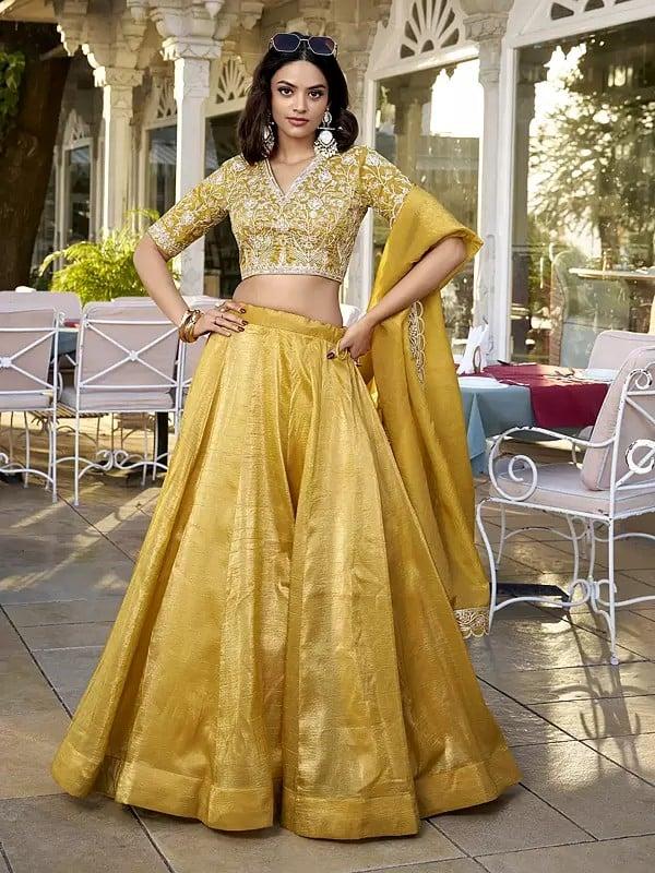 exotic india Saffron-Mango Vichitra Silk Solid Attractive Lehenga Choli With Sequins And Embroidered Matching Dupatta