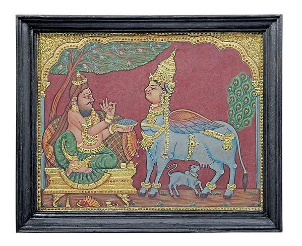 exotic india Sage Kashyapa Worshipping Kamadhenu Tanjore Painting | Traditional Colors with 24K Gold | Teakwood Frame 