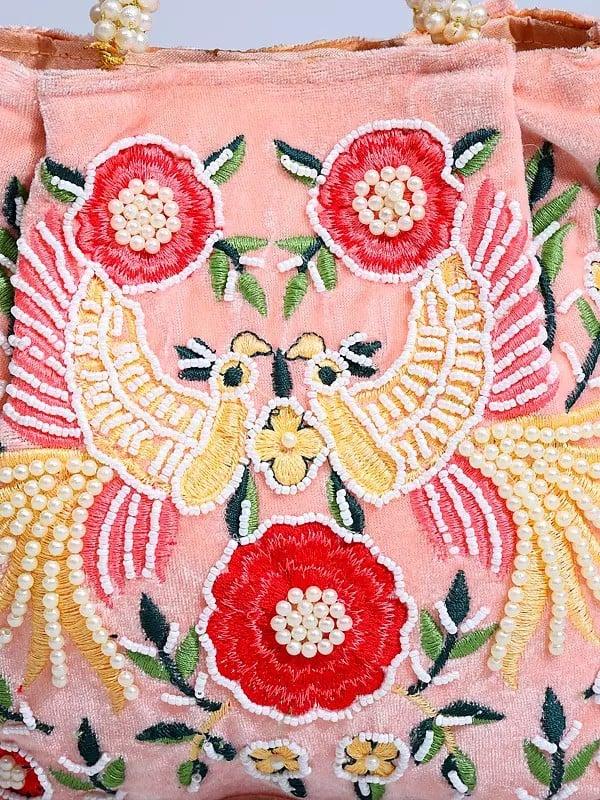 Exotic India Seashell-Pink Velvet Bird Embroidered Hand Bag With Beads Work 