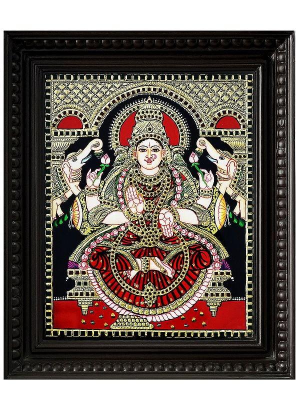 exotic india Seated Goddess Gaja Lakshmi Tanjore Painting with Frame | Traditional Colour with 24 Karat Gold
