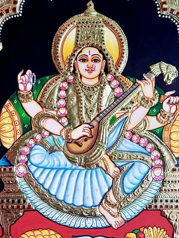 Exotic India Seated Goddess Saraswati Holding Veena | Tanjore Painting | Traditional Colors With Gold Work
