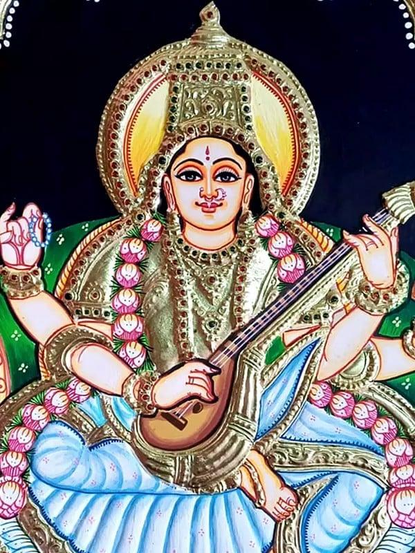 Exotic India Seated Goddess Saraswati Holding Veena | Tanjore Painting | Traditional Colors With Gold Work
