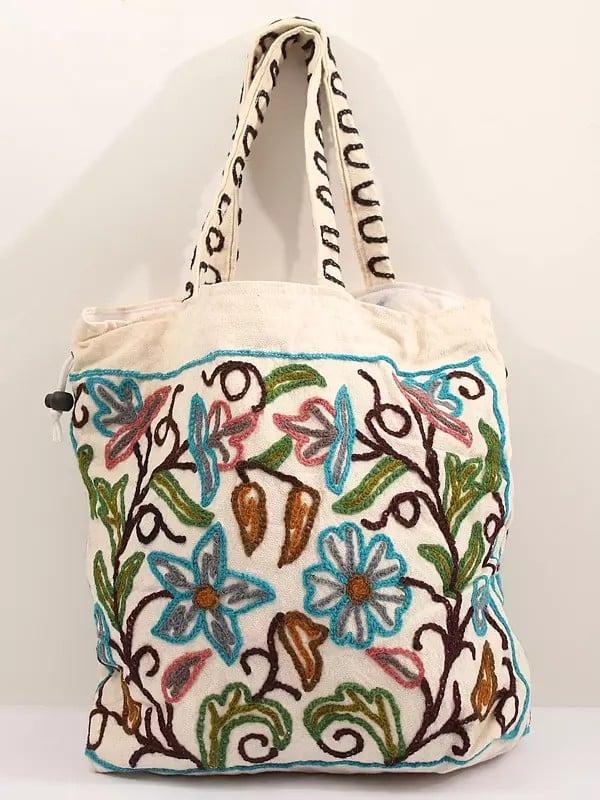Exotic India Snow-White Cotton Shoulder Bag With Crewel Embroidered Flowers 