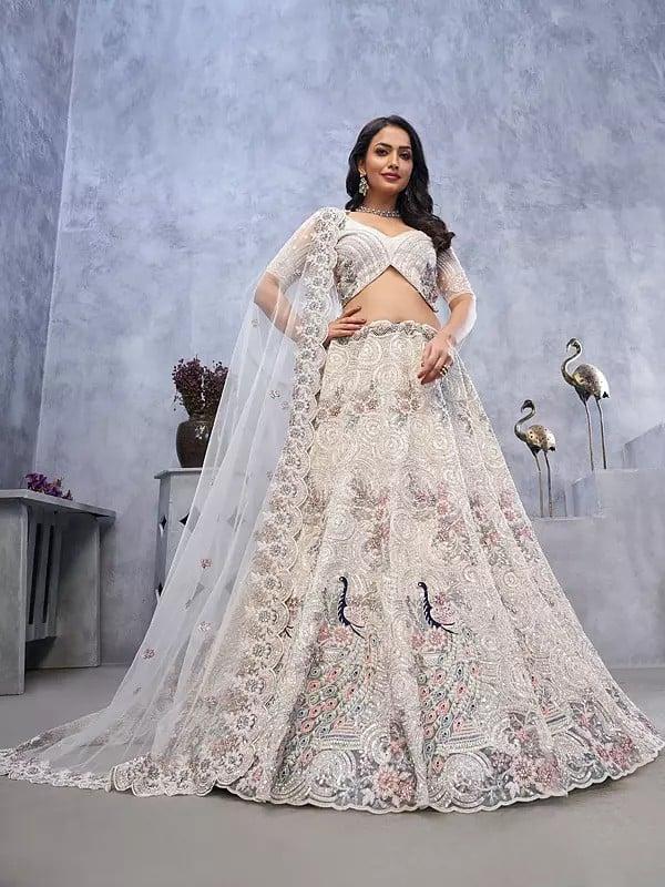 exotic india Soft Net Exquisite Sequins Work Peacock And Bagh Embroidery Fancy Wedding Wear Embellished Lehenga Choli With Attractive Dupatta