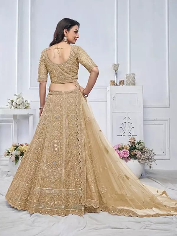 Exotic India Soft Net Heavy Embroidered Bridal Lehenga Choli With Tassels And Matching Dupatta 