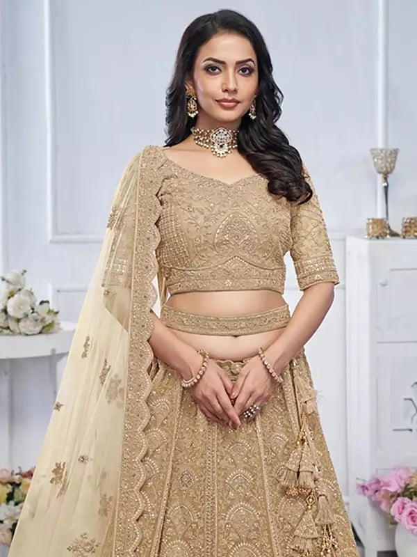 Exotic India Soft Net Heavy Embroidered Bridal Lehenga Choli With Tassels And Matching Dupatta 