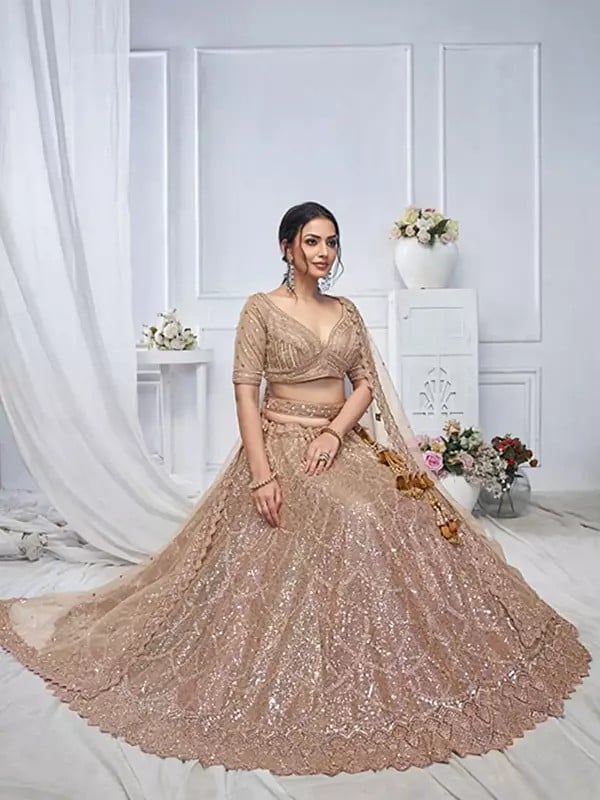 Exotic India Soft Net Sequins Work Wedding Wear Embellished Lehenga Choli With Dori Tassels And Matching Dupatta 