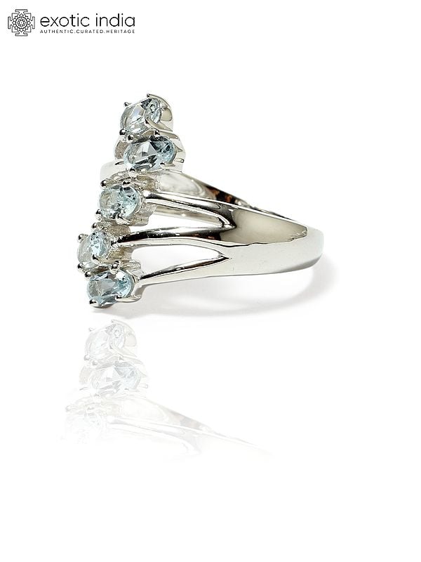 Exotic India Sterling Silver Designer Ring With Faceted Blue Topaz 