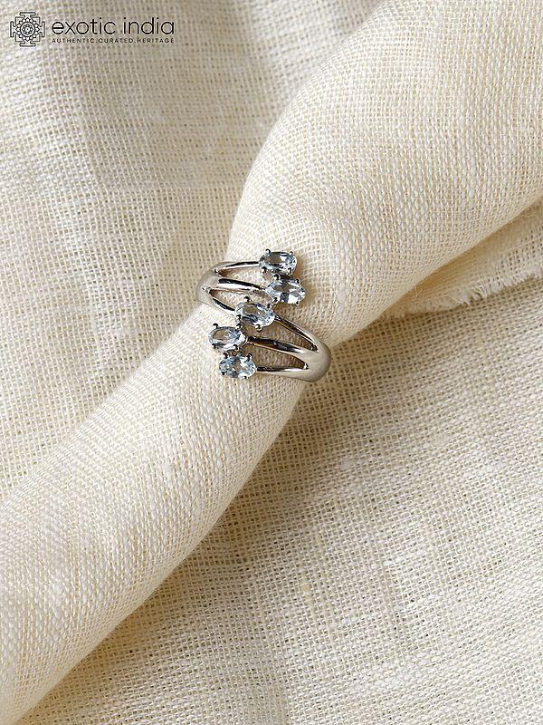 Exotic India Sterling Silver Designer Ring With Faceted Blue Topaz 