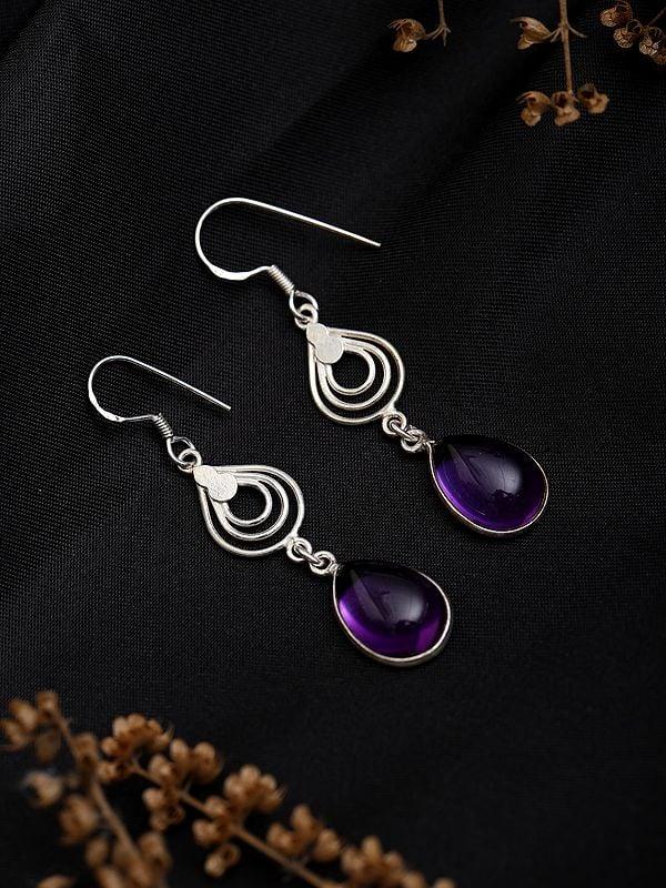 Exotic India Sterling Silver Earrings With Tear Drop Amethyst