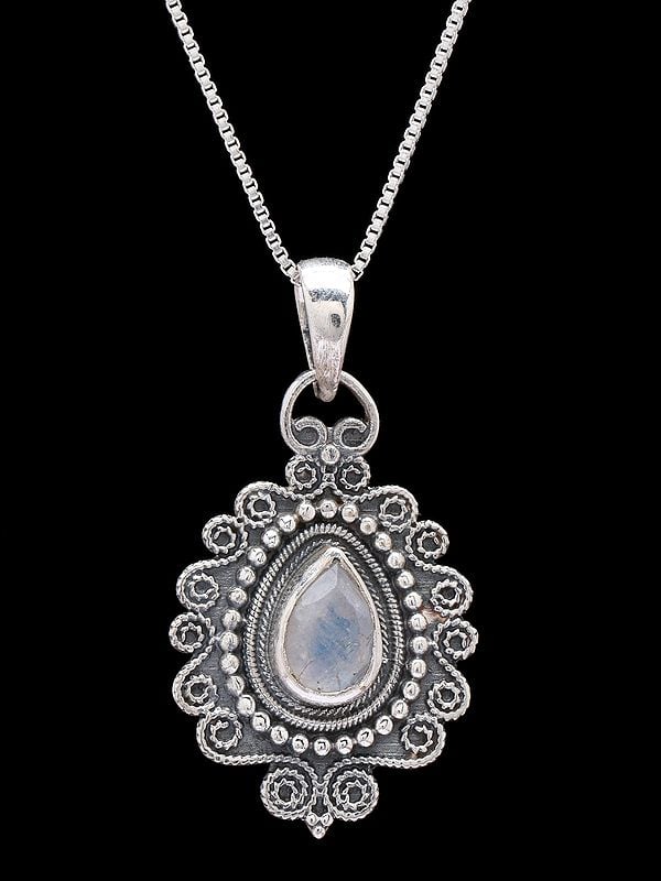 Exotic India Sterling Silver Pendant With Tear-drop Shape Rainbow Moonstone 